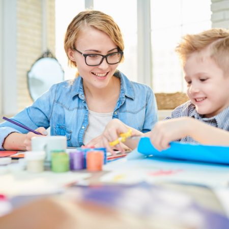 mother-and-son-crafting-together-at-home-LTK34BD.jpg